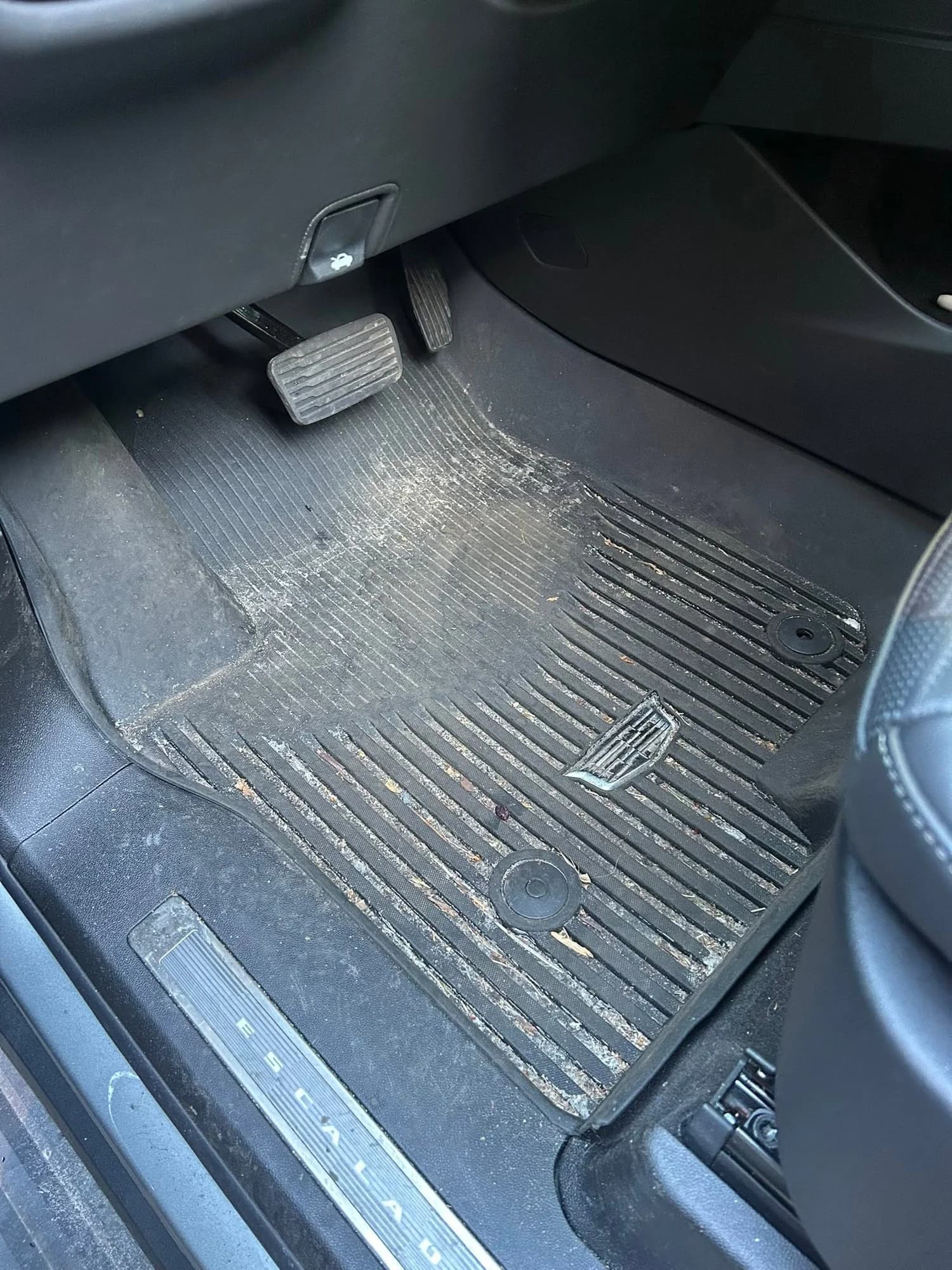 Driver footwell with dirt and debris