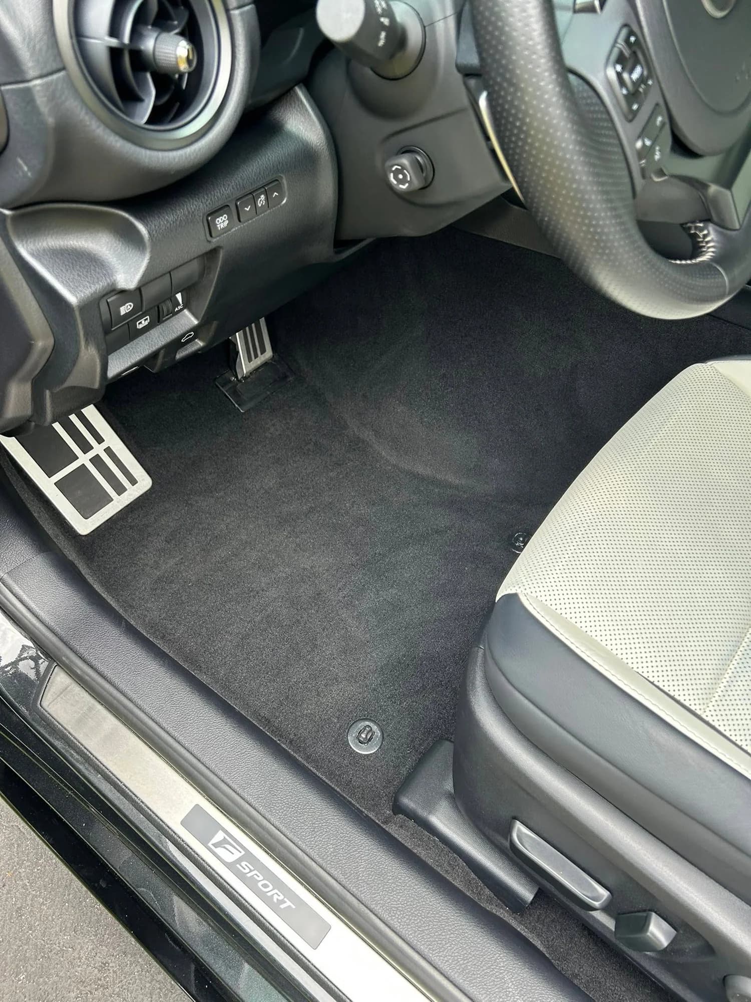 Lexus driver floor mat, pedals, and front seat