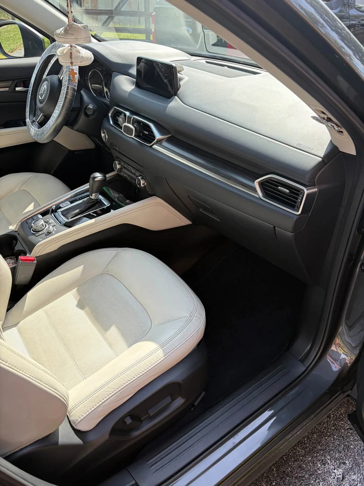 Mazda front passenger seat, dashboard, and floor mat