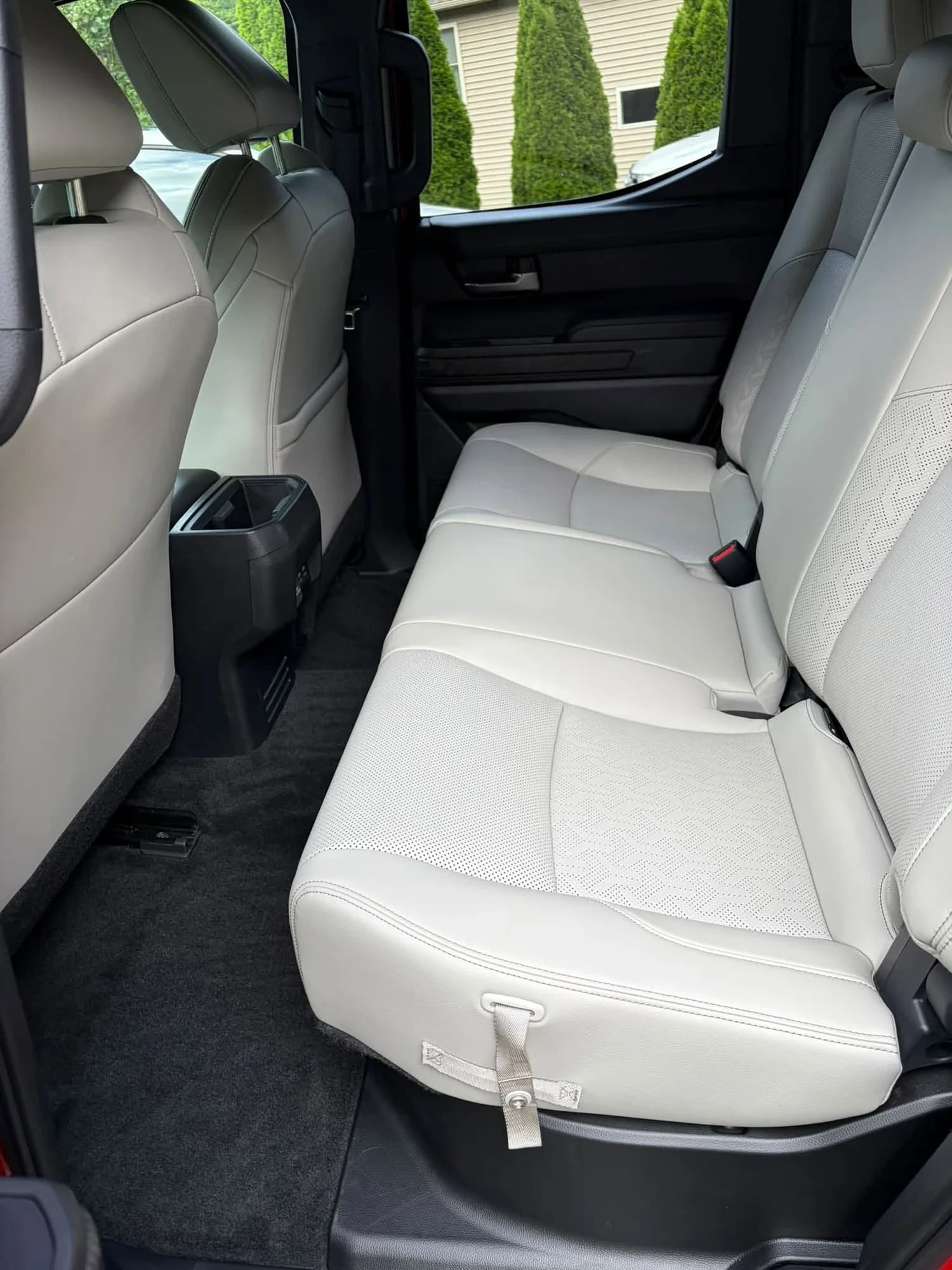 Red Toyota Tacoma rear seats and passenger floor