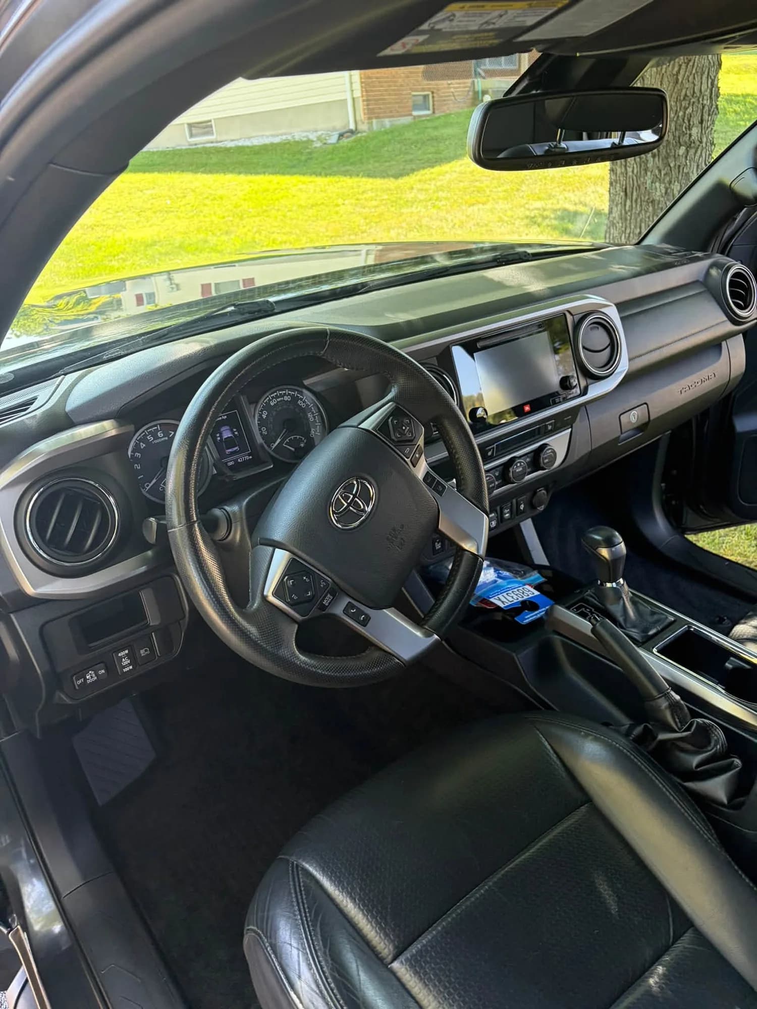 Toyota Tacoma dashboard, steering wheel, and front seats