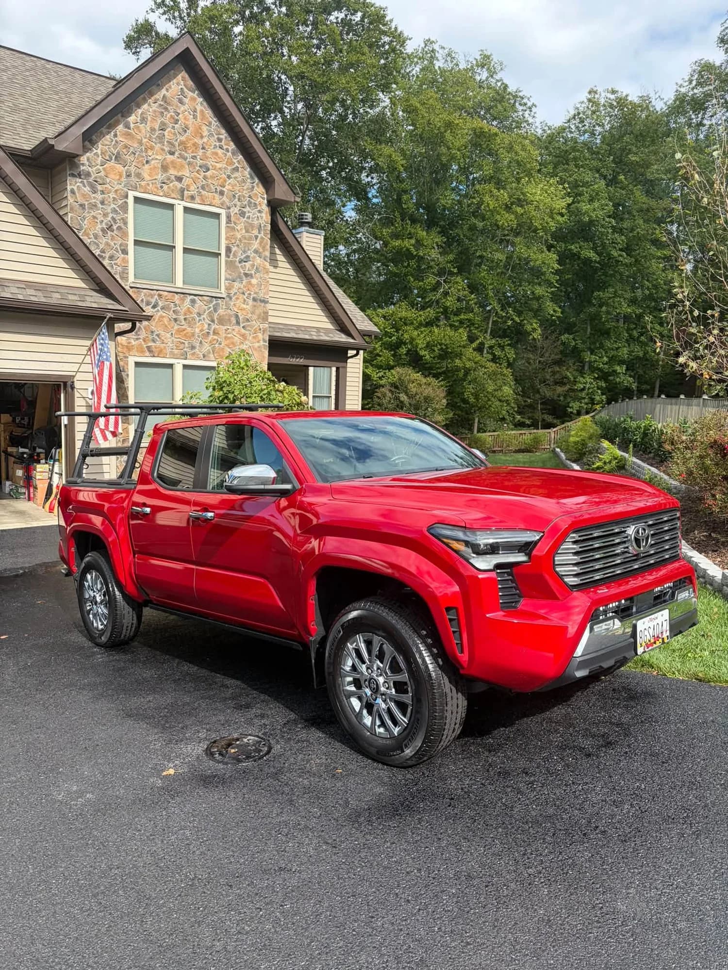 Red Toyota Tacoma exterior in a client driveway